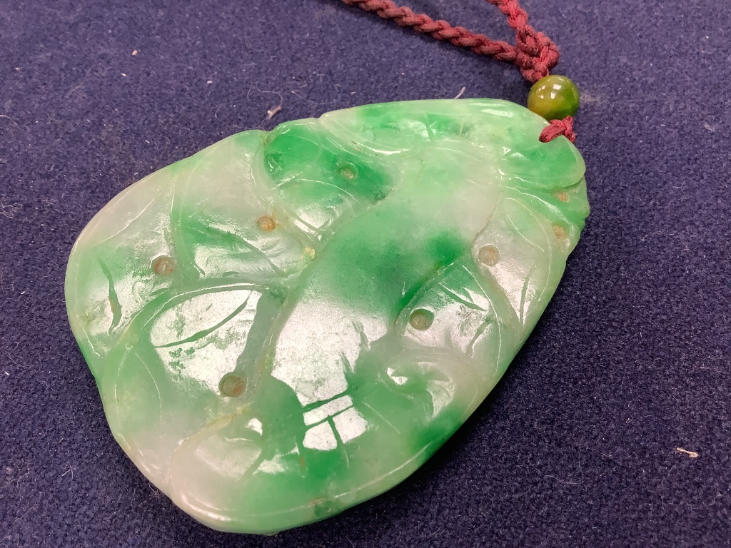 A Chinese jadeite pendant , a pair of bangles, earrings and a cricket pendant